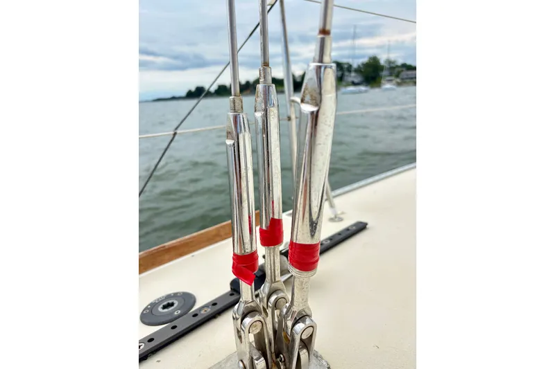 Slide: The Image of Close-up of rigging on a 2000 J Boats J/120 sailboat, with water in the background. - 7