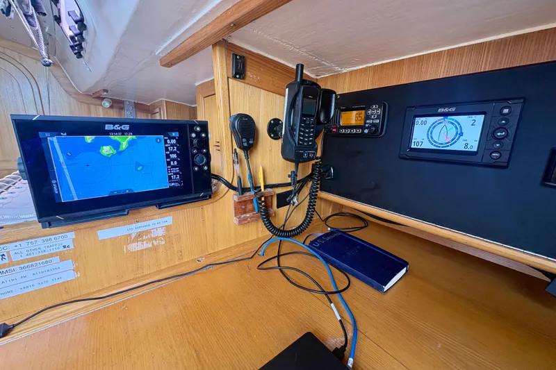 Slide: The Image of Navigation equipment inside a 2000 J Boats J/120 sailboat, featuring B&G displays and communication devices. - 14