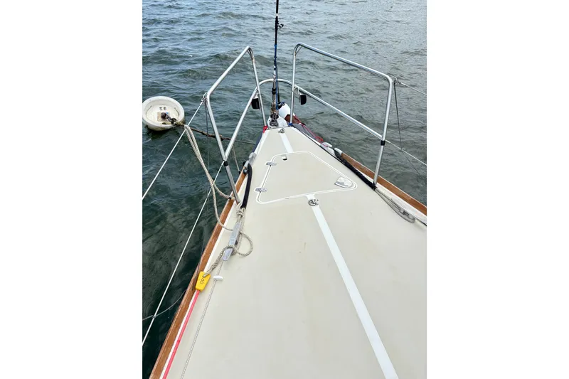 Slide: The Image of Bow view of 2000 J Boats J/120 sailboat on water, featuring deck and railing. - 8