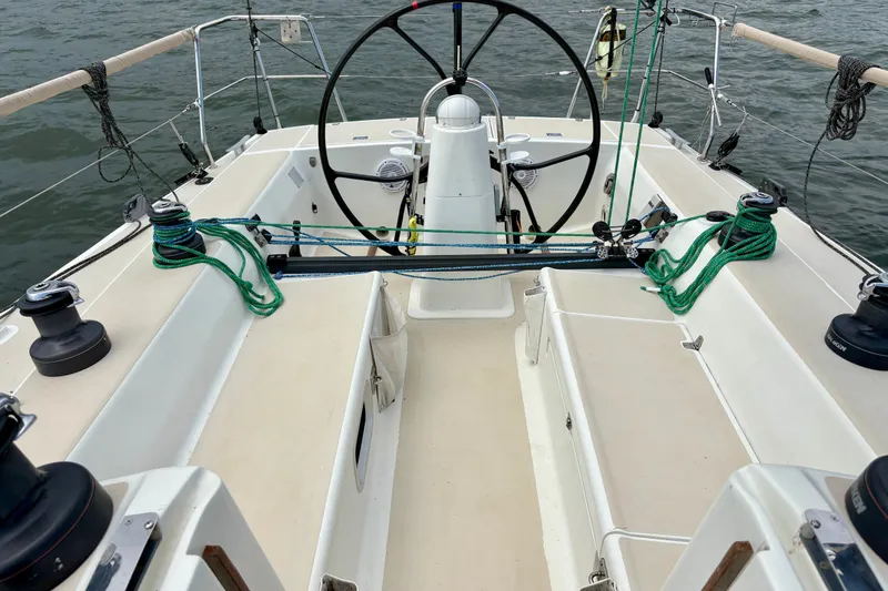 Slide: The Image of Cockpit of a 2000 J Boats J/120 sailboat with steering wheel and rigging. - 5