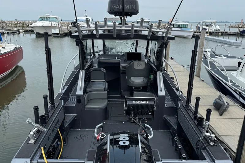 Slide: The Image of 2022 Extreme Boats 745 Walk Around at marina, featuring Garmin equipment and spacious seating. - 6