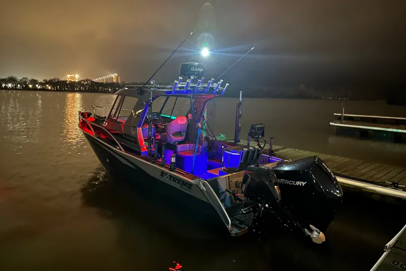 Slide: The Image of 2022 Extreme Boats 745 Walk Around illuminated at night on a calm lake. - 5