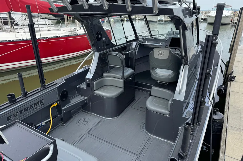 Slide: The Image of 2022 Extreme Boats 745 Walk Around, sleek interior design, docked at marina. - 7