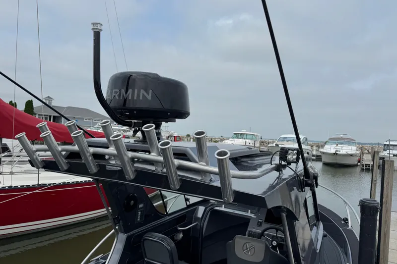 Slide: The Image of 2022 Extreme Boats 745 Walk Around with radar and rod holders at marina. - 8