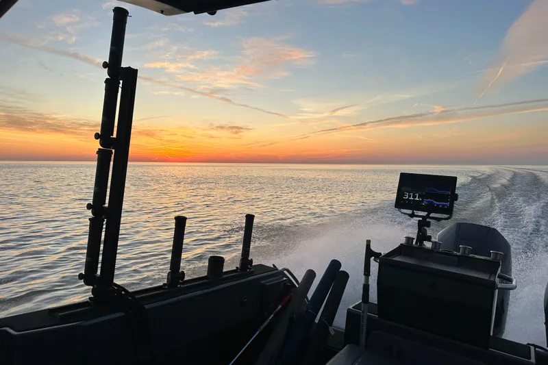 Slide: The Image of 2022 Extreme Boats 745 Walk Around cruising at sunset on open water. - 12