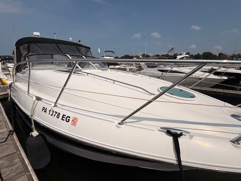 Slide: The Image of 2005 Doral Intrigue docked with a black canopy and sleek lines. - 6