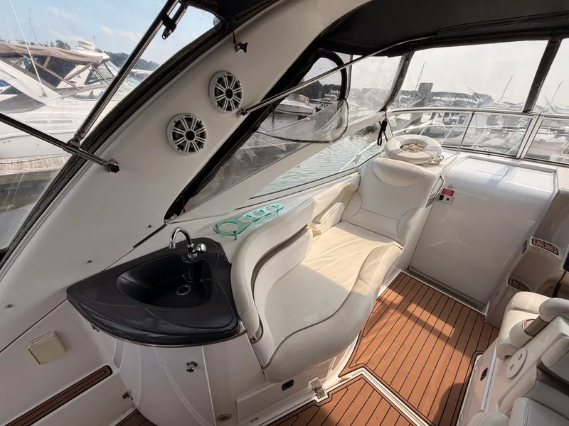 Slide: The Image of The image shows the cockpit of a 2005 Doral Intrigue with white seating and a sink. - 12