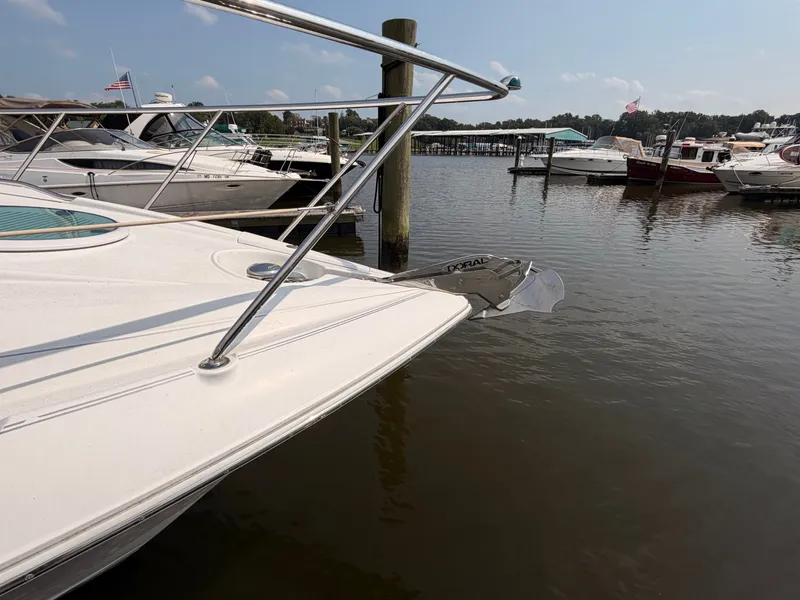 Slide: The Image of A 2005 Doral Intrigue boat is docked in a calm marina. - 5