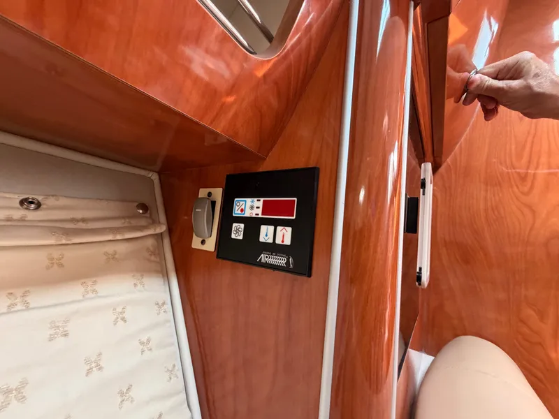 Slide: The Image of Interior of a 2005 Doral Intrigue with wood paneling and a control panel. - 33