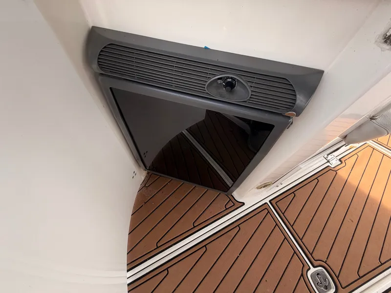Slide: The Image of A refrigerator is built into the deck of a 2005 Doral Intrigue boat. - 13