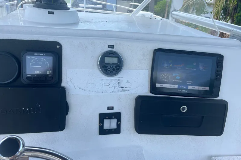 Slide: The Image of Console of 2003 Robalo R230 Center Console boat with Garmin and Suzuki displays. - 7