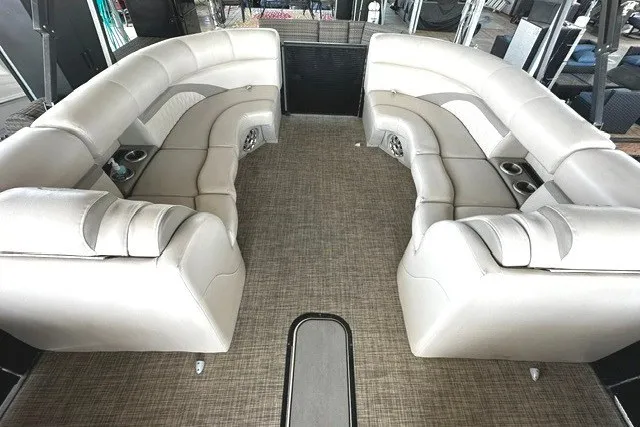 Slide: The Image of Luxurious seating on 2019 Harris Sunliner 240 pontoon boat with beige upholstery. - 11