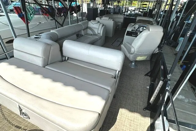 Slide: The Image of 2019 Harris Sunliner 240 pontoon boat interior with spacious seating and modern helm. - 13