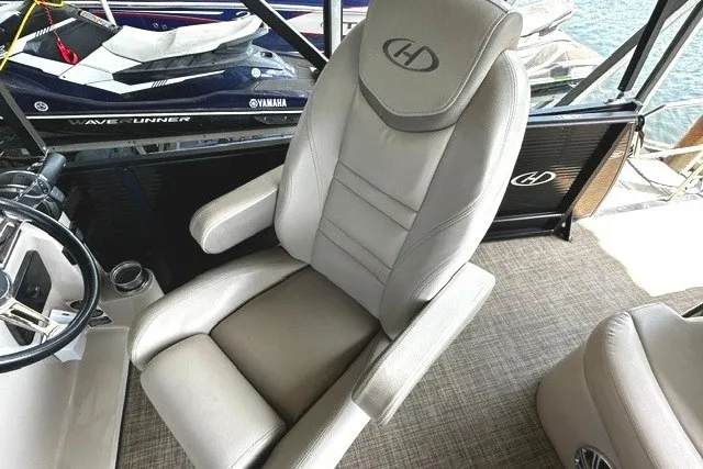 Slide: The Image of Captain's chair on 2019 Harris Sunliner 240 pontoon boat, featuring luxurious design and comfort. - 16