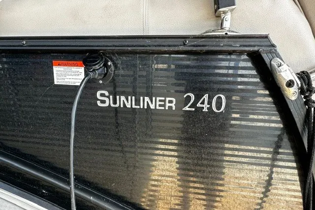 Slide: The Image of 2019 Harris Sunliner 240 boat panel with warning label and cable. - 6