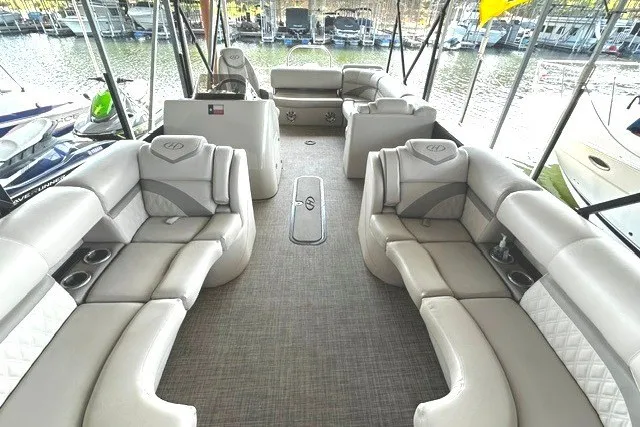 Slide: The Image of Luxurious 2019 Harris Sunliner 240 pontoon boat interior with plush seating and lake view. - 9