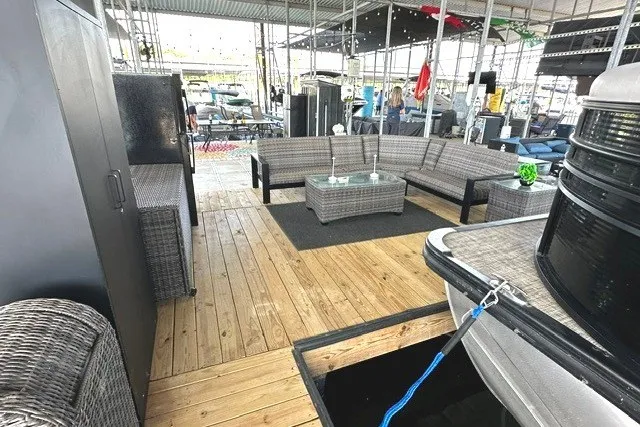 Slide: The Image of 2019 Harris Sunliner 240 pontoon boat with spacious deck and comfortable seating. - 37