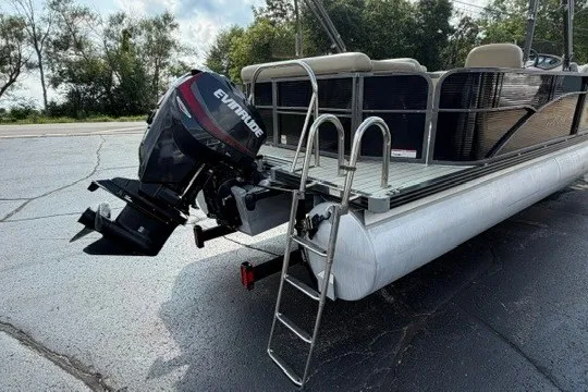 Slide: The Image of 2017 Manitou 22 Oasis Standard pontoon boat with Evinrude motor and ladder. - 8