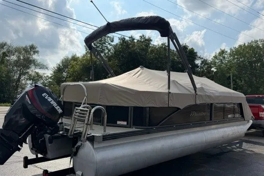 Slide: The Image of 2017 Manitou 22 Oasis Standard pontoon boat with canopy and Evinrude motor. - 37