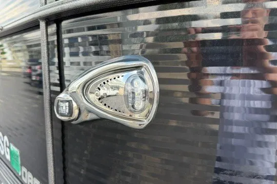 Slide: The Image of 2017 Manitou 22 Oasis Standard boat detail with sleek exterior light fixture. - 7