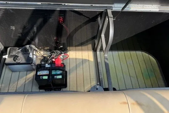 Slide: The Image of 2017 Manitou 22 Oasis Standard boat interior with battery and wiring setup. - 36