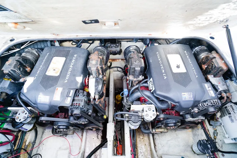 Slide: The Image of Engine compartment of a 2004 Regal Commodore 2860 boat with Volvo Penta engines. - 29