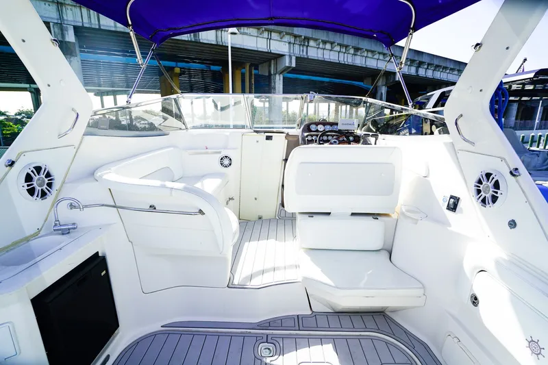 Slide: The Image of 2004 Regal Commodore 2860 boat interior with white seating and modern dashboard. - 4