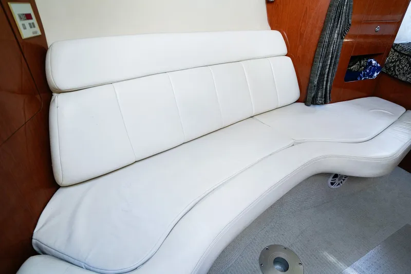 Slide: The Image of White leather seating in 2004 Regal Commodore 2860 boat interior. - 17
