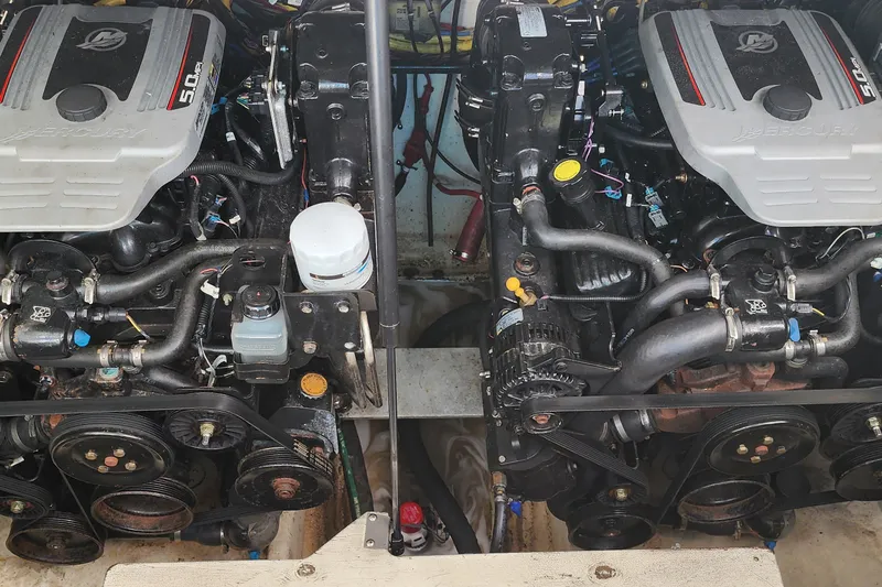 Slide: The Image of Twin Mercury 5.0 engines in a 2008 Bayliner 300 boat engine compartment. - 19
