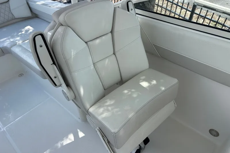 Slide: The Image of White leather seat on 2024 World Cat 230 SD boat, showcasing luxury and comfort. - 14
