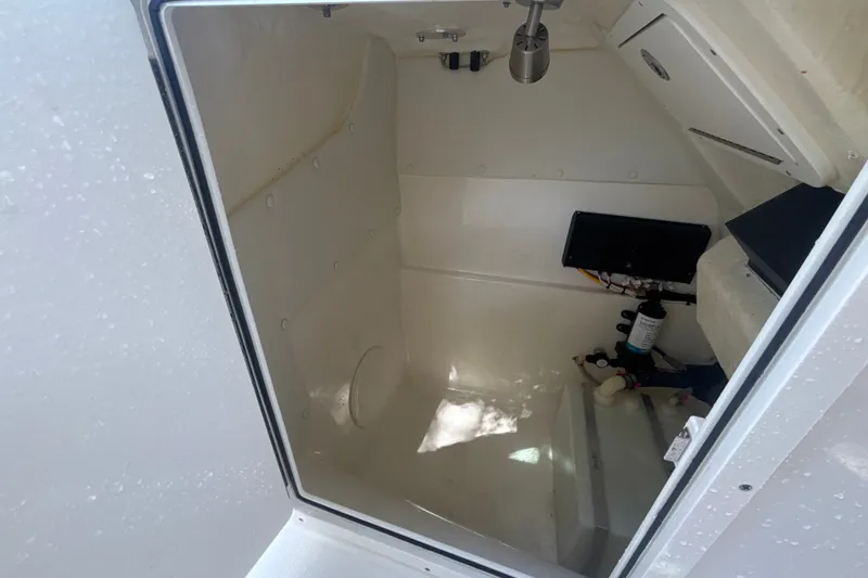 Slide: The Image of Interior view of 2024 World Cat 230 SD boat storage compartment. - 19