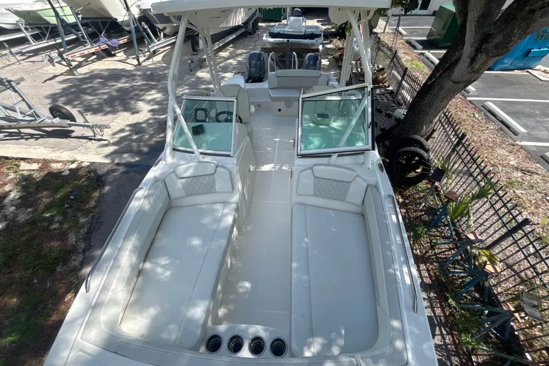 Slide: The Image of 2024 World Cat 230 SD boat with spacious seating and modern design. - 11