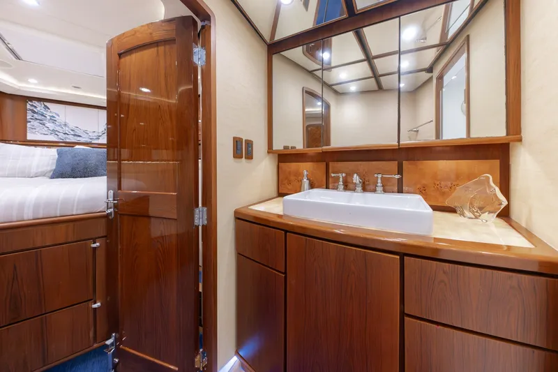 Slide: The Image of Luxurious yacht bathroom with wooden cabinetry and modern sink, Jamie Chadwick 61' Convertible, 2010. - 96