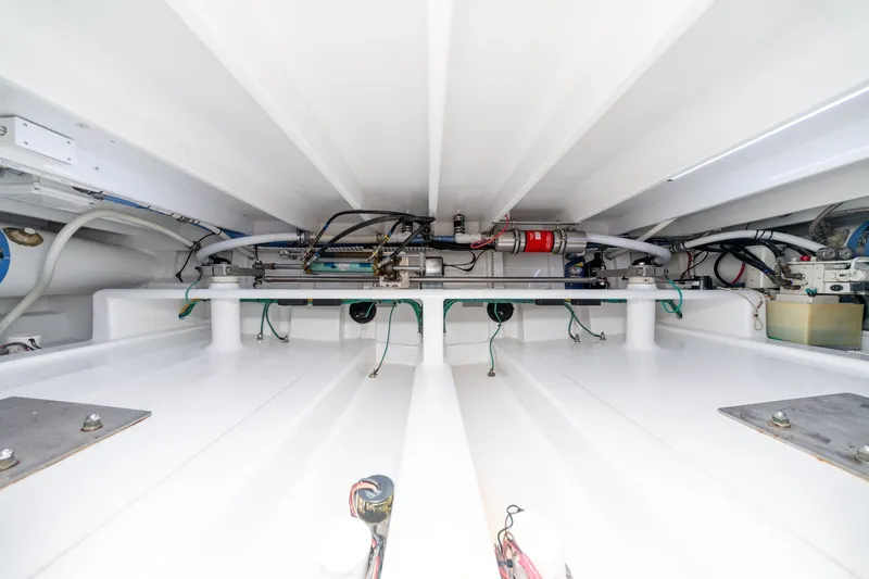 Slide: The Image of Engine room of 2010 Jamie Chadwick 61' Convertible yacht, showcasing clean, organized mechanical systems. - 53