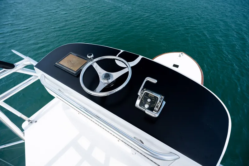 Slide: The Image of Steering console of 2010 Jamie Chadwick 61' Convertible yacht on open water. - 66