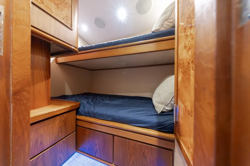 Slide: The Image of Luxurious wooden bunk beds in a 2010 Jamie Chadwick 61' Convertible yacht cabin. - 90