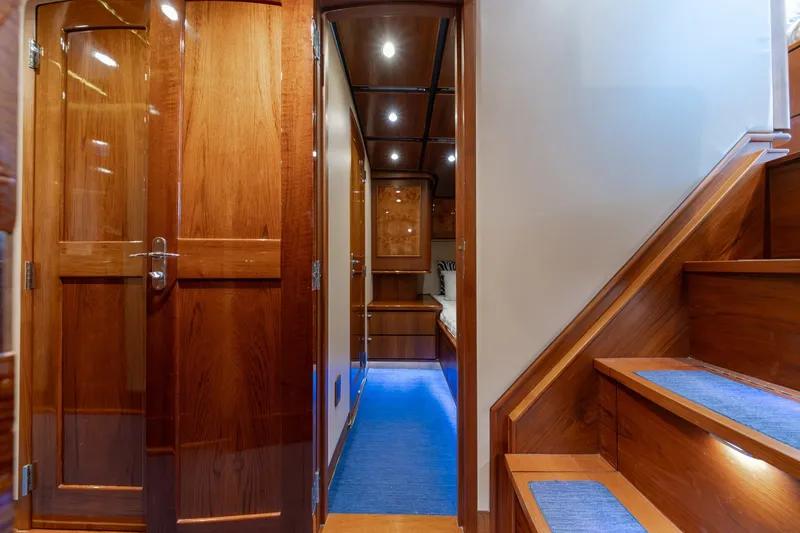 Slide: The Image of Luxurious interior of a 2010 Jamie Chadwick 61' Convertible yacht with polished wood finishes. - 82