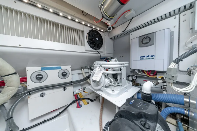 Slide: The Image of Engine room of a 2010 Jamie Chadwick 61' Convertible yacht with Dolphin Pro equipment. - 42