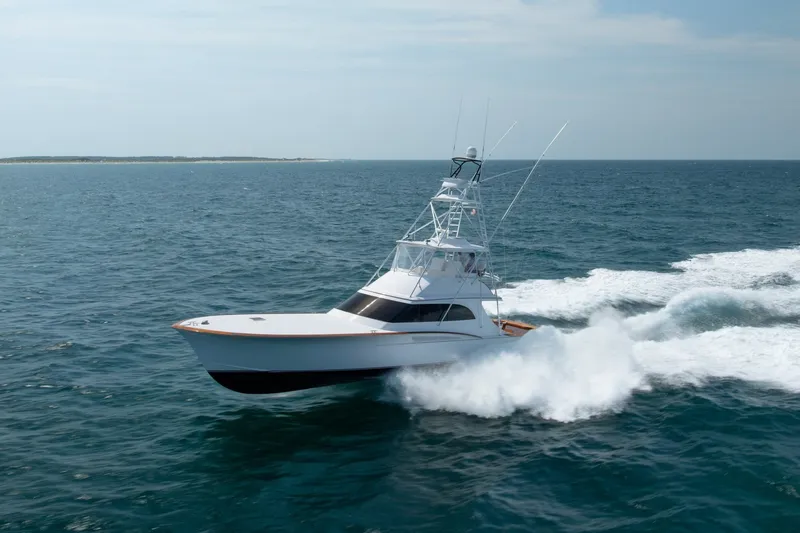 The Image of Luxurious 2010 Jamie Chadwick 61' Convertible yacht cruising on open sea. - 0