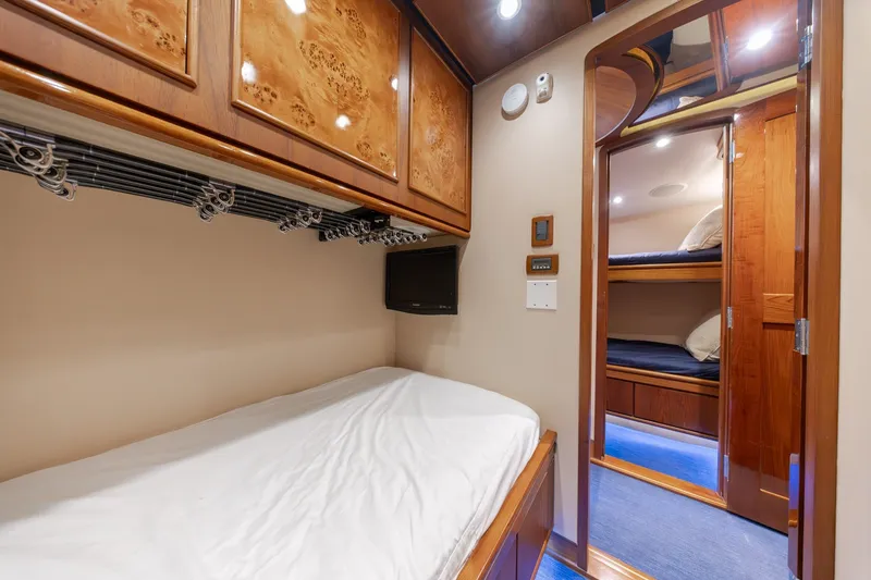 Slide: The Image of Luxurious cabin interior of 2010 Jamie Chadwick 61' Convertible yacht with cozy bedding. - 84