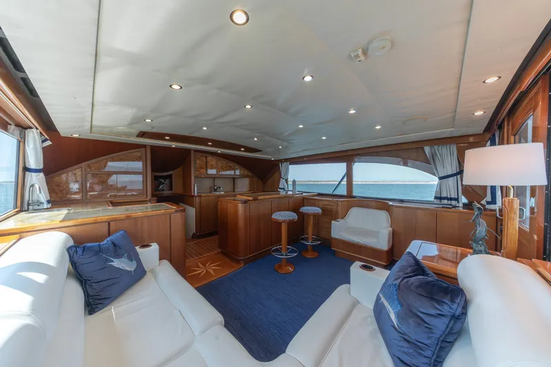 Slide: The Image of Luxurious interior of a 2010 Jamie Chadwick 61' Convertible yacht with elegant seating and ocean views. - 72