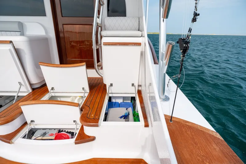 Slide: The Image of 2010 Jamie Chadwick 61' Convertible yacht with open storage compartments on deck, ocean view. - 27