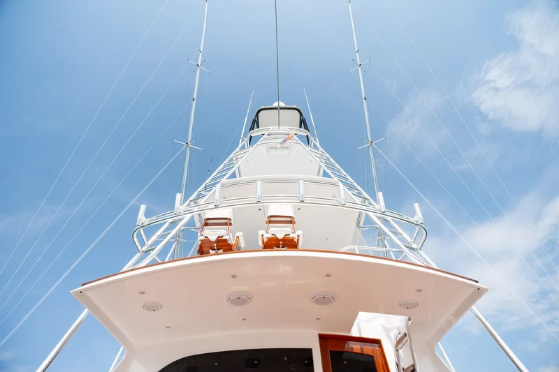 Slide: The Image of 2010 Jamie Chadwick 61' Convertible yacht, viewed from below against a clear blue sky. - 69