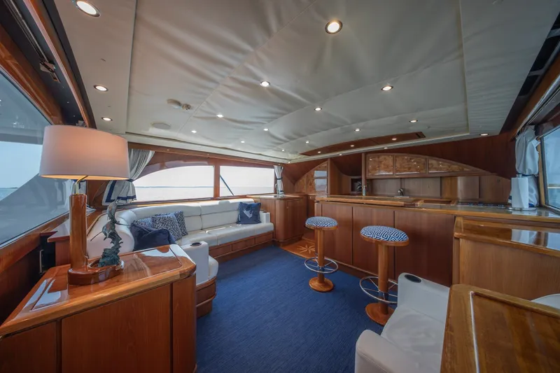 Slide: The Image of Luxurious interior of a 2010 Jamie Chadwick 61' Convertible yacht with elegant wood finishes. - 71