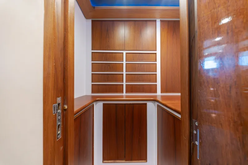 Slide: The Image of Luxurious wooden cabinetry inside a 2010 Jamie Chadwick 61' Convertible yacht. - 92