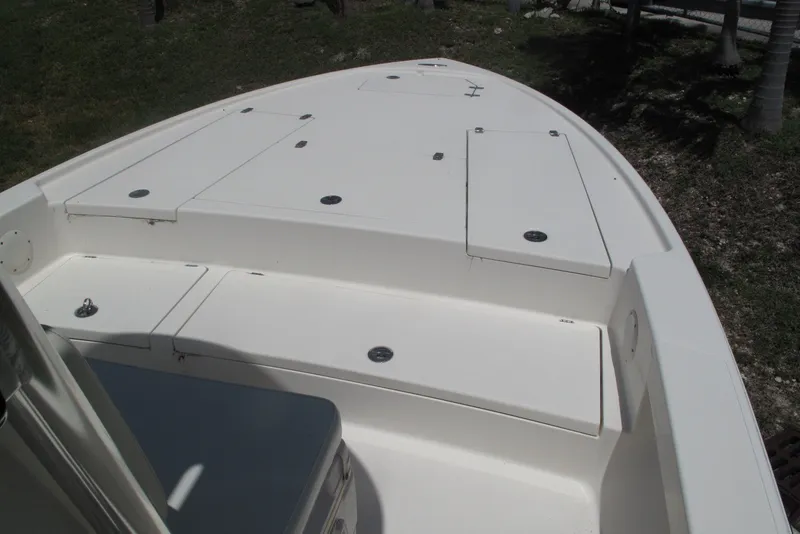 Slide: The Image of 2018 Pathfinder 2500 Hybrid boat deck with storage compartments, white finish. - 26