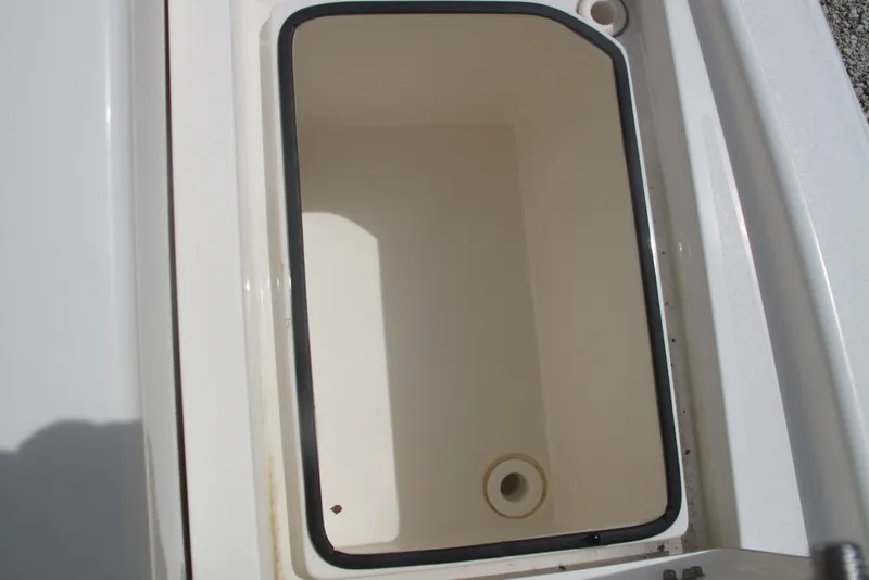 Slide: The Image of Storage compartment of a 2018 Pathfinder 2500 Hybrid boat, featuring a clean, spacious interior. - 19