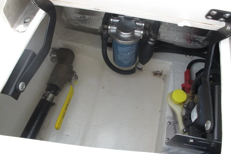 Slide: The Image of Engine compartment of a 2018 Pathfinder 2500 Hybrid boat, showing hoses and components. - 24
