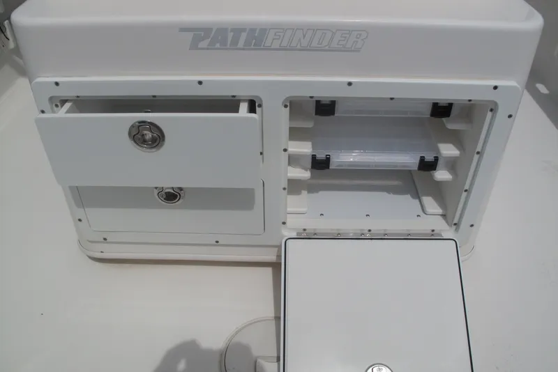 Slide: The Image of Pathfinder 2500 Hybrid 2018 boat storage compartments with drawers and shelves. - 17