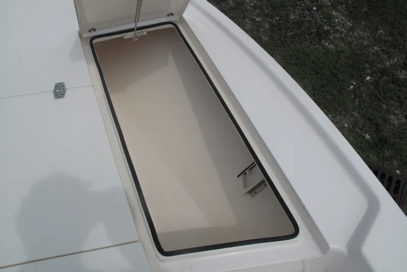 Slide: The Image of Open storage compartment on 2018 Pathfinder 2500 Hybrid boat, showcasing interior space. - 13
